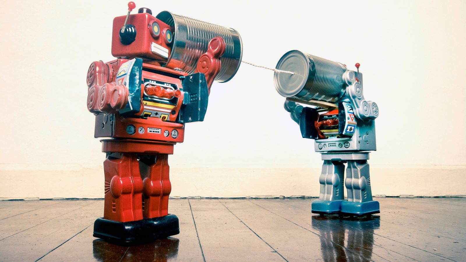 A tin can telephone connected by a string represents the highly manual and outdated processes of traditional bilingual review